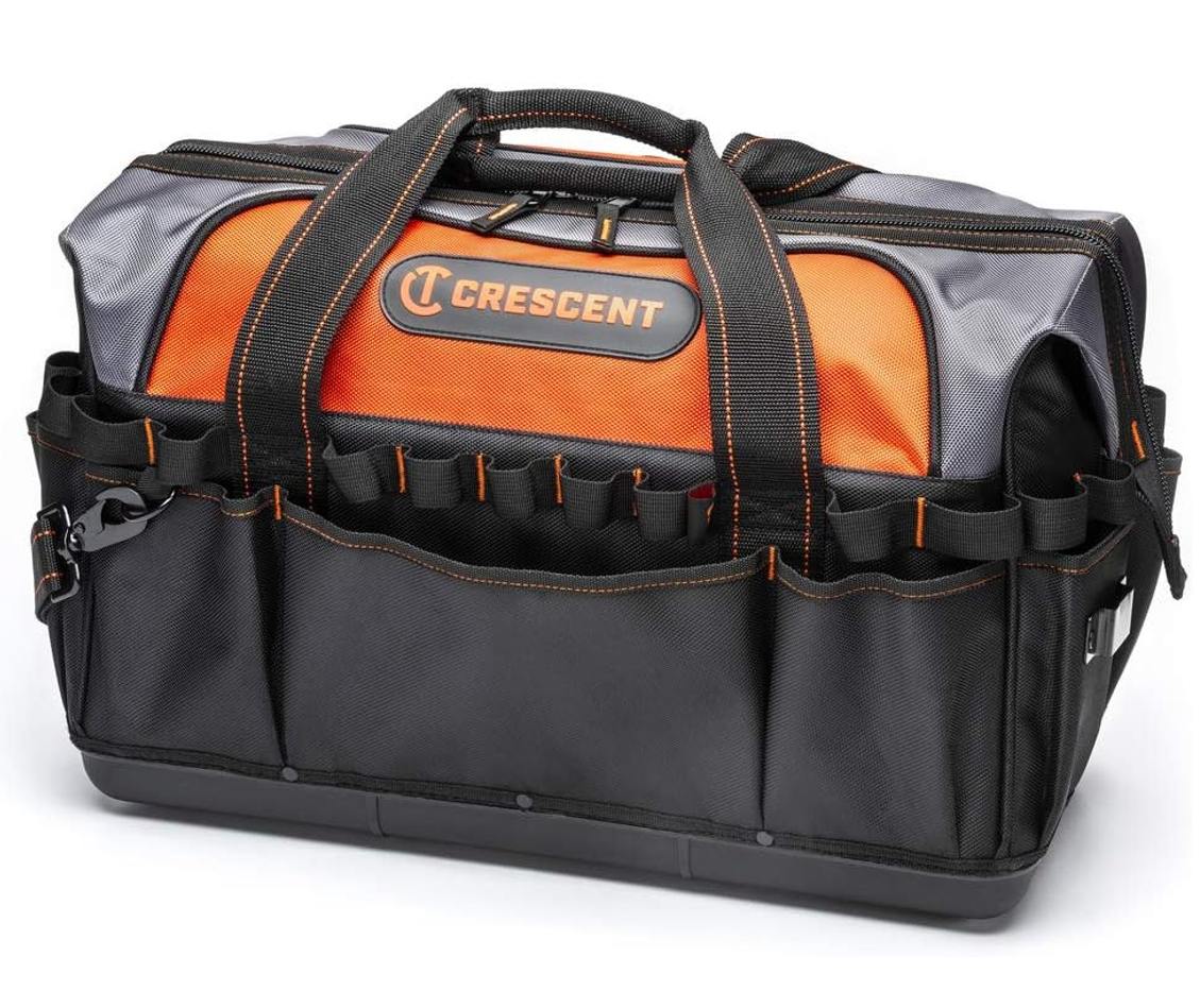 An angled studio shot of the closed Crescent 20-inch contractor tool bag, emphasizing the rugged construction, the strong carrying handles, and the side attachment point for the shoulder strap.