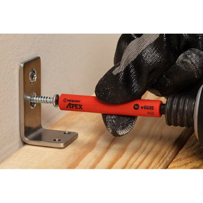 An action shot showing the Crescent u-GUARD non-marring power bit being used to drive a screw through a metal bracket, demonstrating how the protective sleeve prevents surface scratches.