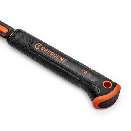 Close-up of the Crescent ergonomic fawn's foot grip handle, showing the textured proprietary materials used for the VibeGuard vibration control system and the 22oz weight marking.