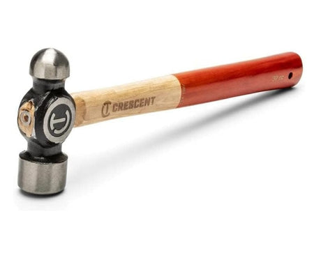 Angled perspective of the Crescent 24 oz. ball peen hammer highlighting the polished ball end and flat striking face of the alloy steel head secured to a high-quality hickory handle.
