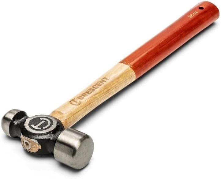 Full view of the Crescent 24 oz. wood ball peen hammer at an angle, illustrating the premium wood grain of the hickory handle and the robust forged steel head design.