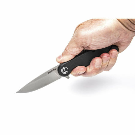 A hand holds the open Crescent CPK325C pocket knife, demonstrating its ergonomic grip.