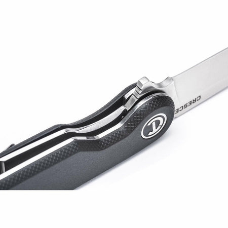 A detailed close-up of the open Crescent CPK325C, showing the heavy-duty liner lock mechanism and ball-bearing flipper tab.