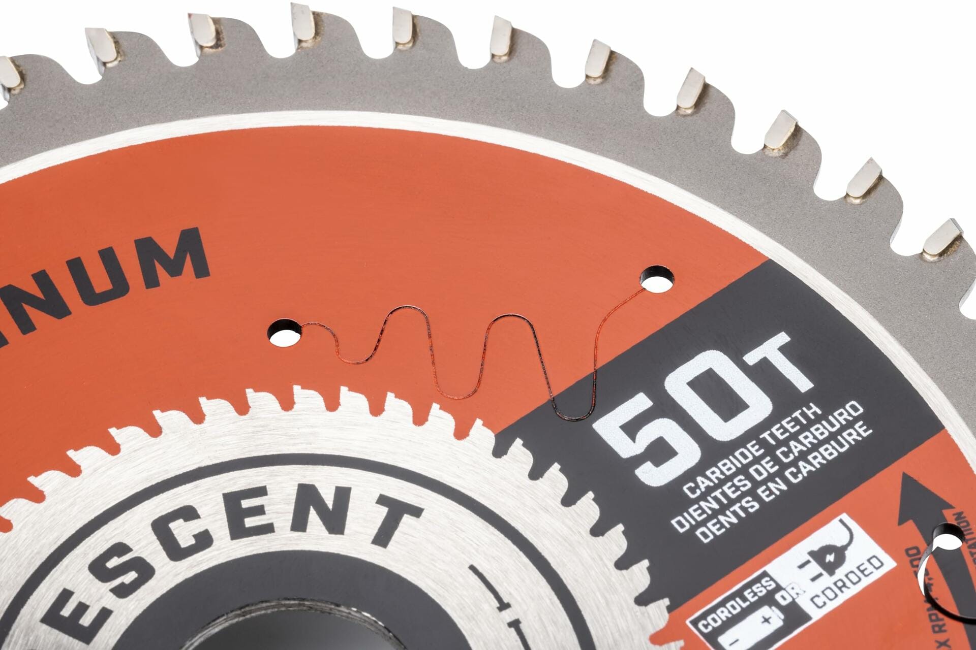 A close-up view of the laser-cut vibration slot and 50T carbide teeth marking on the Crescent aluminum cutting blade.