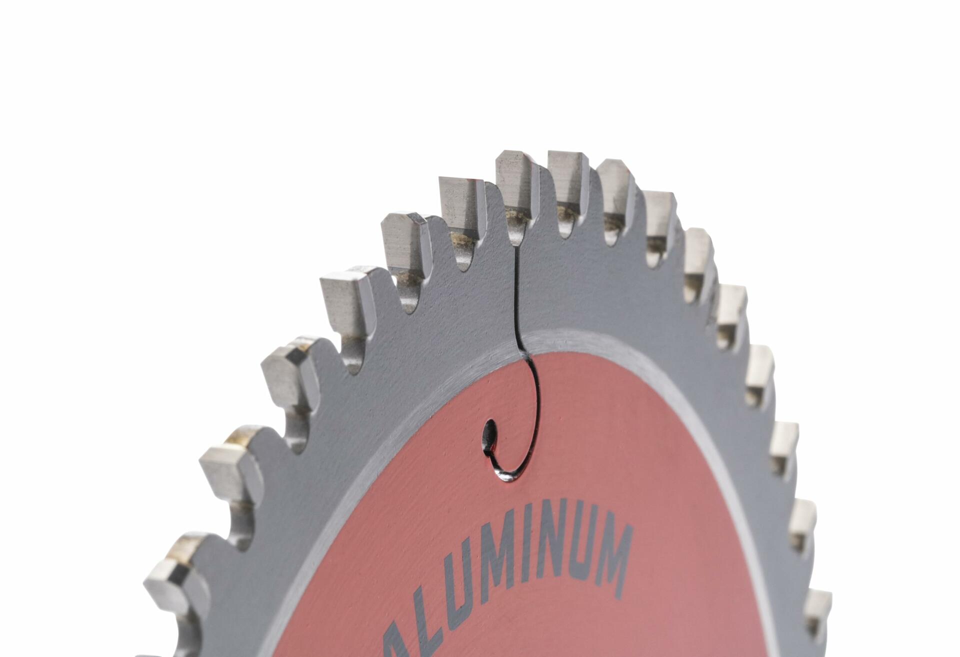 A macro detail shot of the High Velocity premium carbide teeth on the Crescent aluminum cutting blade.