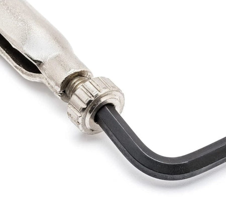 Close-up demonstration showing a hex key inserted into the adjustment screw recess, illustrating the tool's ability to achieve maximum clamping force