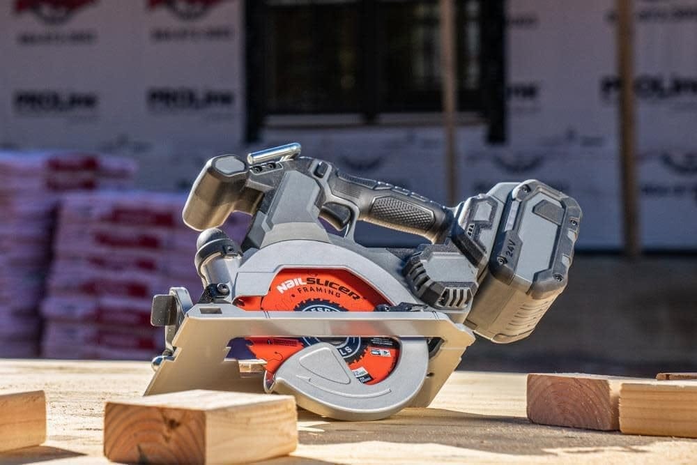 A cordless circular saw sitting on a wood workpiece with the Crescent NailSlicer framing blade installed, demonstrating its compatibility with modern high-performance battery-powered tools.