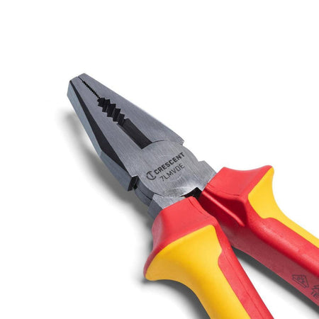 Close-up detail of the serrated jaws and laser-hardened wire cutter on the Crescent lineman’s pliers, showcasing the precision-machined pivot and polished alloy steel construction.