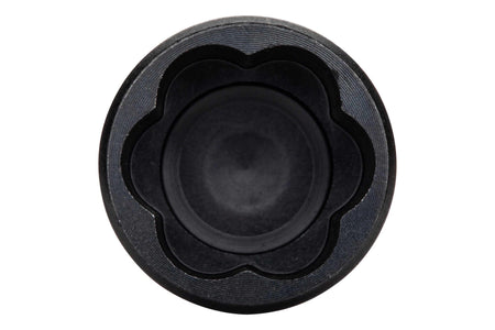 Top-down close-up macro view looking directly into the socket of the Crescent APEX 1/2-inch Bolt Biter, revealing the unique internal tapered flute bi-directional design engineered to grip severely damaged hex fasteners.