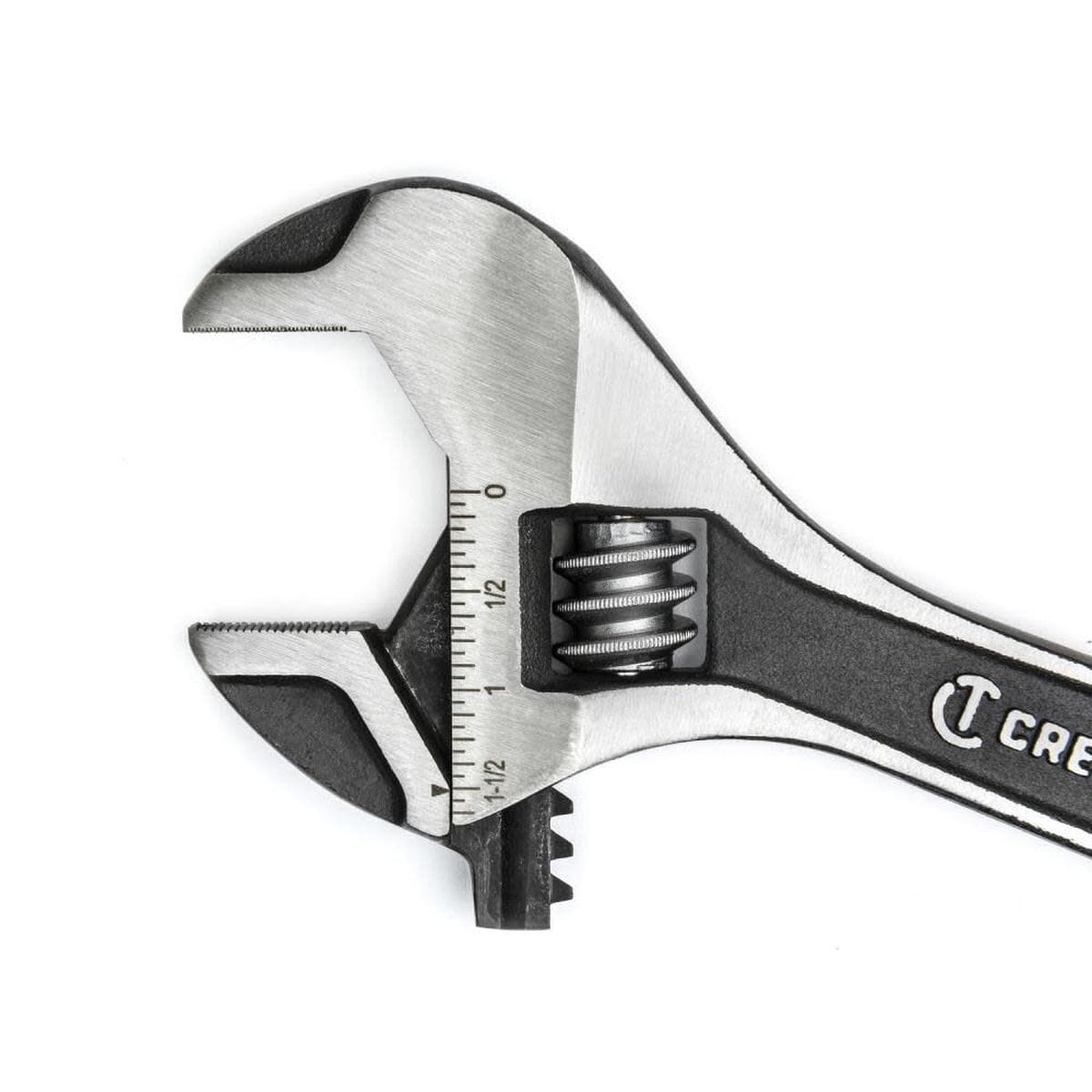 An extreme macro studio photograph focusing entirely on the open head configuration of the Crescent hand tool, detailing the micro-serrated teeth patterns inside the jaws and the high-contrast laser-etched dimension increments.