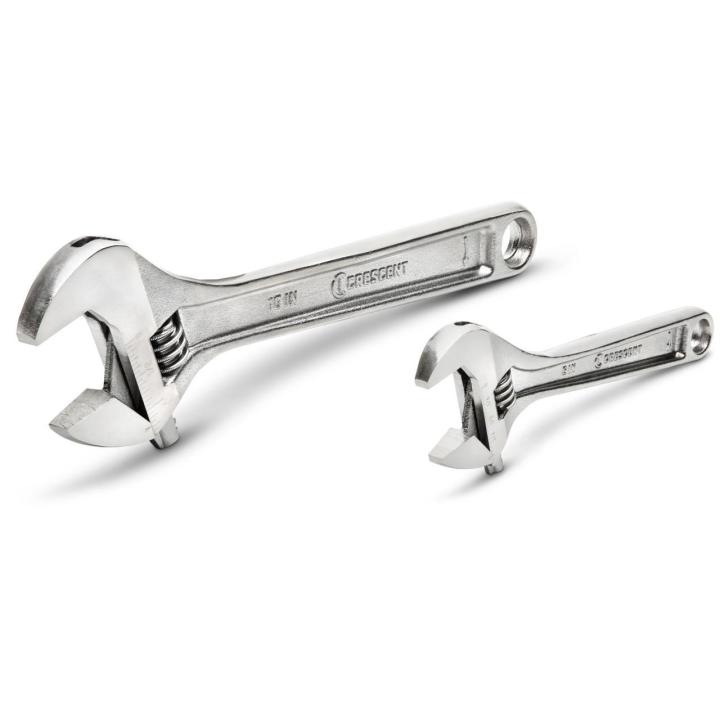 An angled studio shot of the Crescent AC2610VS 2-piece adjustable wrench set against a crisp white background. The 10-inch and 6-inch forged alloy steel tools are laid out to display their wide handles and specialized hex jaw profile designed to prevent fastener rounding.