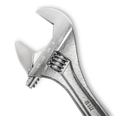 Macro close-up shot focusing on the head of the 6-inch compact hand tool from the Crescent AC2610VS wrench set. The permanent laser-etched SAE and metric scale markings are highly visible along the jaw jaw profile next to the precision adjustment knurl.