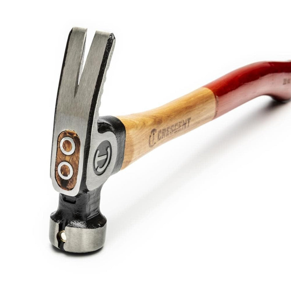 Close-up angled view of the Crescent CHFRAM22 framing hammer head showing the high-strength steel head attachment and the integrated magnetic nail starter.