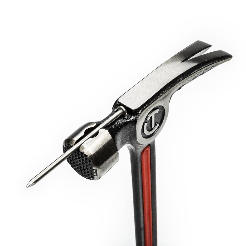Close-up view of the Crescent CHSFRM22 hammer head demonstrating the integrated magnetic nail starter holding a framing nail for quick and easy one-handed starting.