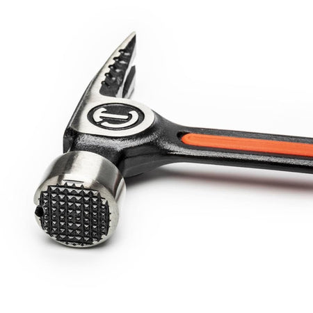 Detailed view of the Crescent 22 oz hammer head focusing on the milled checkered strike face designed to prevent miss-hits and provide greater impact on lumber.