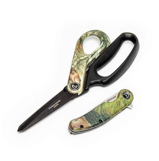 Angled overhead view of the Crescent Camo set, displaying the shears with large ergonomic finger loops and the closed pocket knife resting side-by-side on a white background.