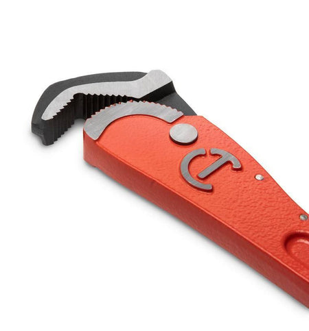 Close-up detail shot of the self-adjusting pipe wrench head showcasing the aggressive angled tooth configuration and the black oxide finish on the moving jaw parts for maximum durability.
