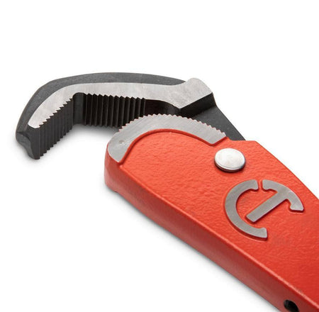 Close-up detail of the self-adjusting pipe wrench head showing the aggressive angled teeth designed for a secure bite and the pivoting jaw mechanism for fast ratcheting action.