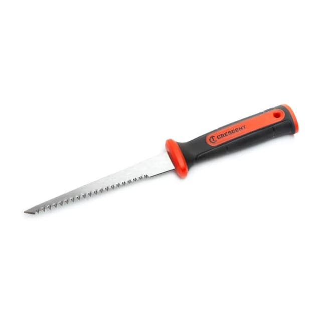 Angled studio shot of the Crescent jab saw resting on a white background, displaying the serrated steel blade and the black and orange dual-material handle with the Crescent logo.