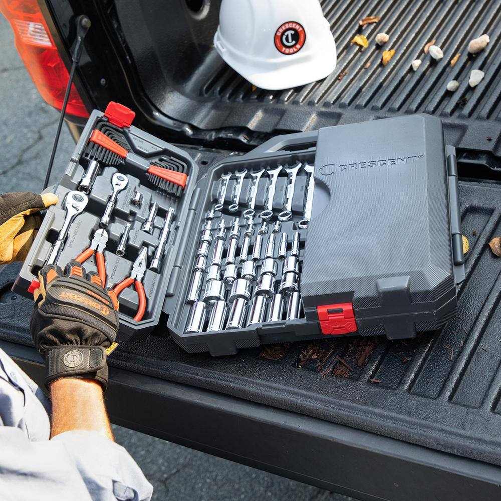 A lifestyle shot of the Crescent CTK180 tool set in its carrying case resting on the tailgate of a truck, demonstrating its portability and organization for mobile mechanics.