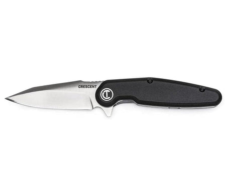 Side profile view of the Crescent professional pocket knife from the measure and cut set, featuring a sleek black handle with the white Crescent logo and a sharp stainless steel harpoon blade.