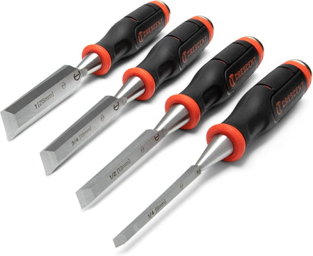 A studio product view of the Crescent CWCHS4 4-piece wood chisel set. The image shows the tools arranged diagonally, showcasing the four different blade widths with their ergonomic black and orange comfort-grip handles and high-carbon steel blades.