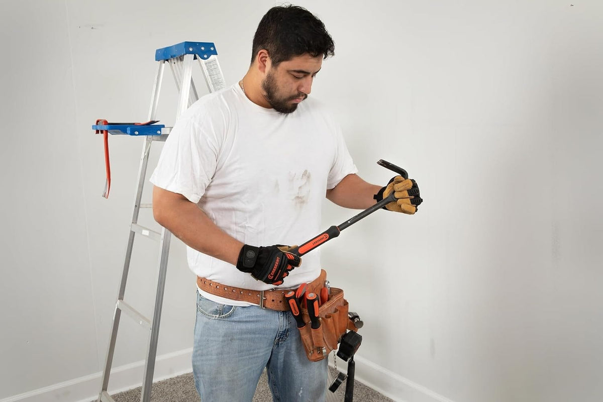 A worker wearing a tool belt holds the Crescent DB18X-06 indexing pry bar and adjusts its movable head.
