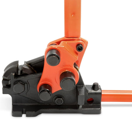 A detailed close-up studio shot of the orange linkage and black pivot points on the head of the 0590RBJN rebar cutter and bender.