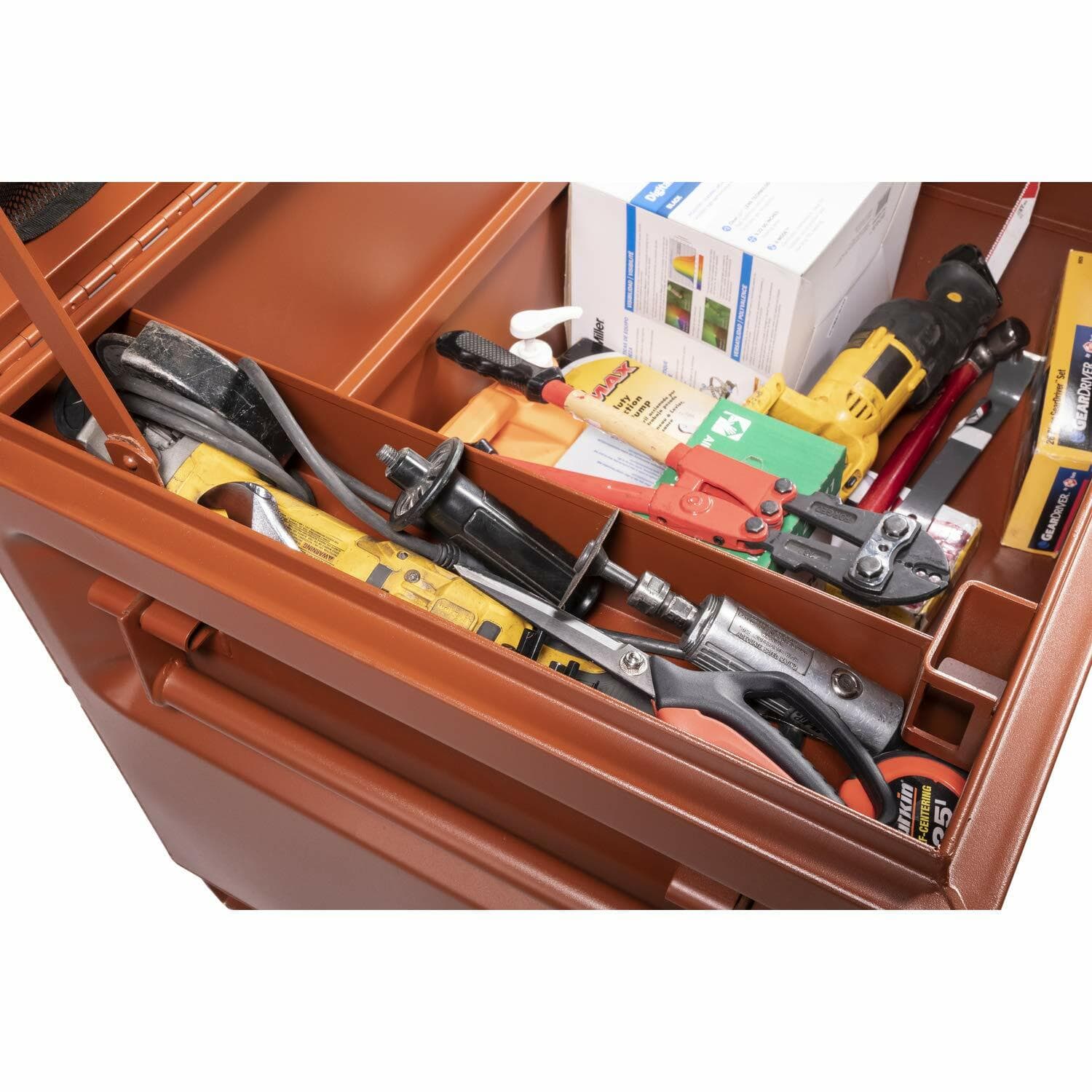 Interior of Crescent JOBOX drawer containing assorted tools including screwdrivers, pliers, utility knife, caulking gun, wire stripper, and packaged items. Compartmentalized layout supports organized jobsite tool access.