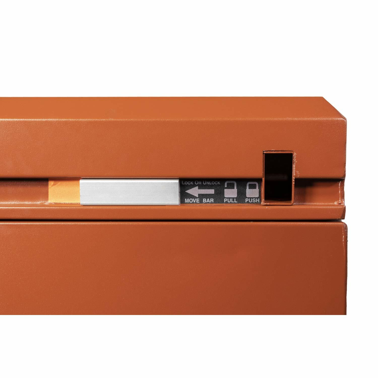 Close-up of locking mechanism on orange Crescent JOBOX chest showing labeled control panel with instructions and buttons. Includes metallic bar and black slot for secure access control in industrial storage applications.