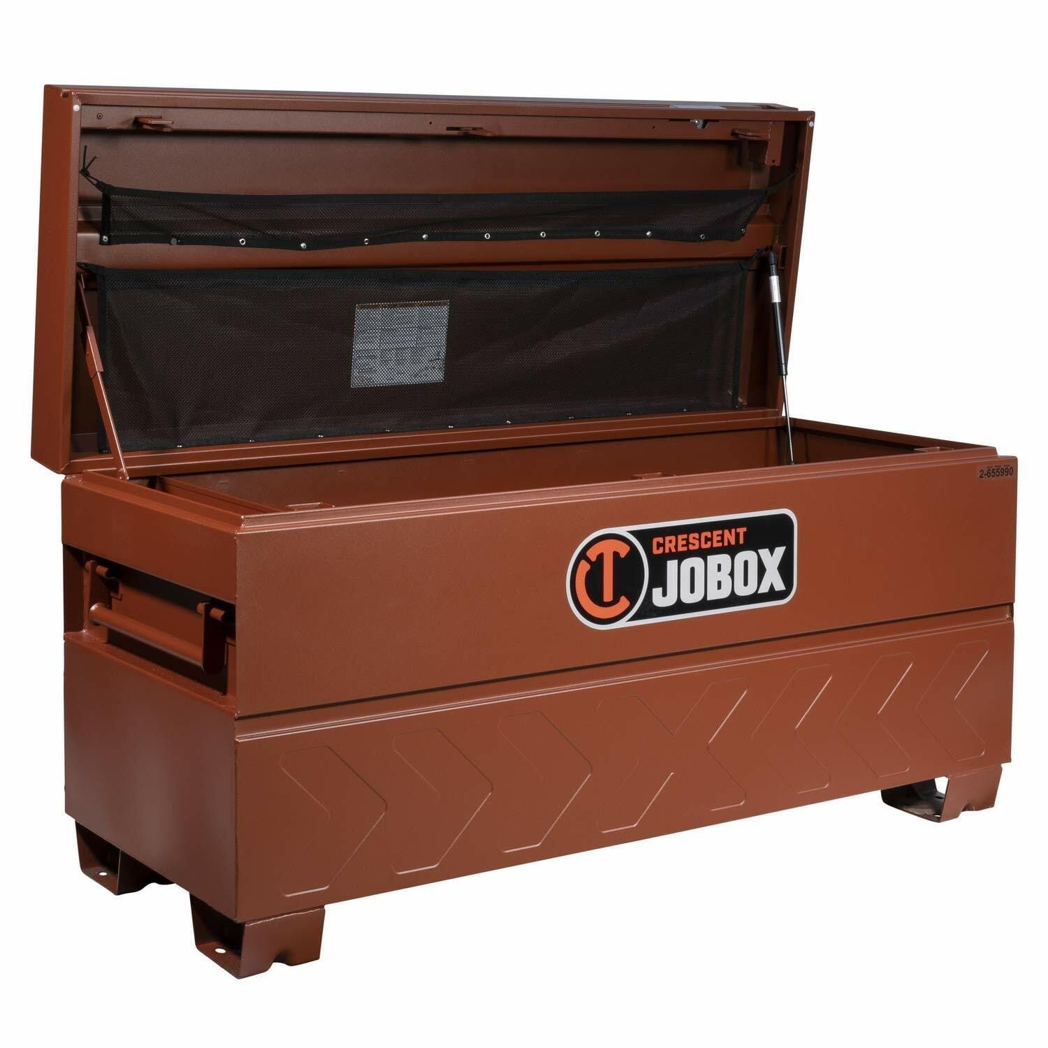 Open Crescent JOBOX industrial storage chest with reinforced corners, side handles, and gas strut-supported lid. Interior includes mesh compartment for organizing small items. Built for secure jobsite use.