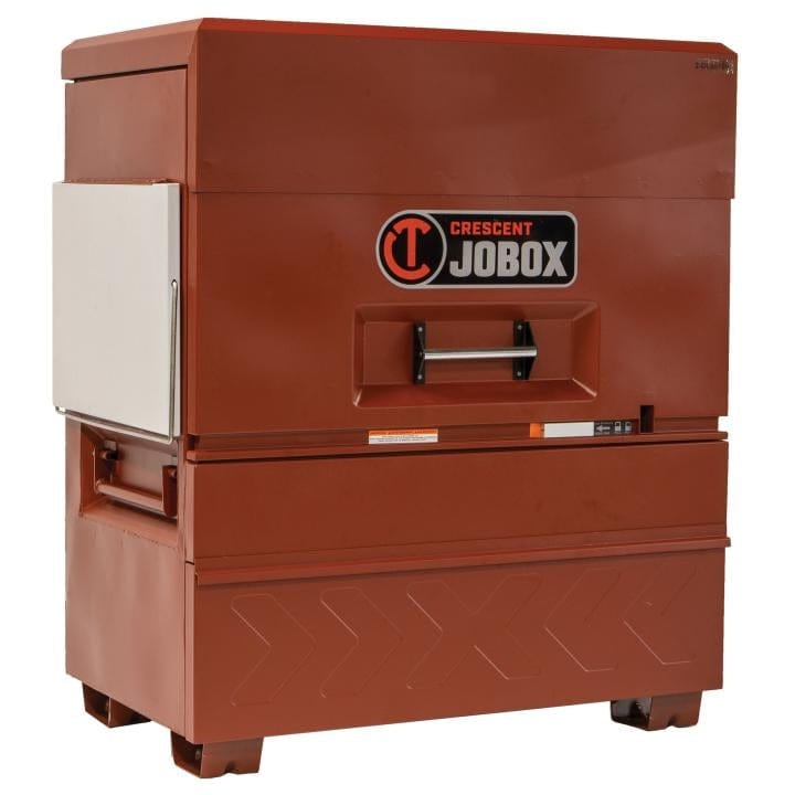 Crescent JOBOX 48-inch Site-Vault heavy-duty piano box jobsite storage cabinet, closed from a slight angle. The lid and drawer are secured.