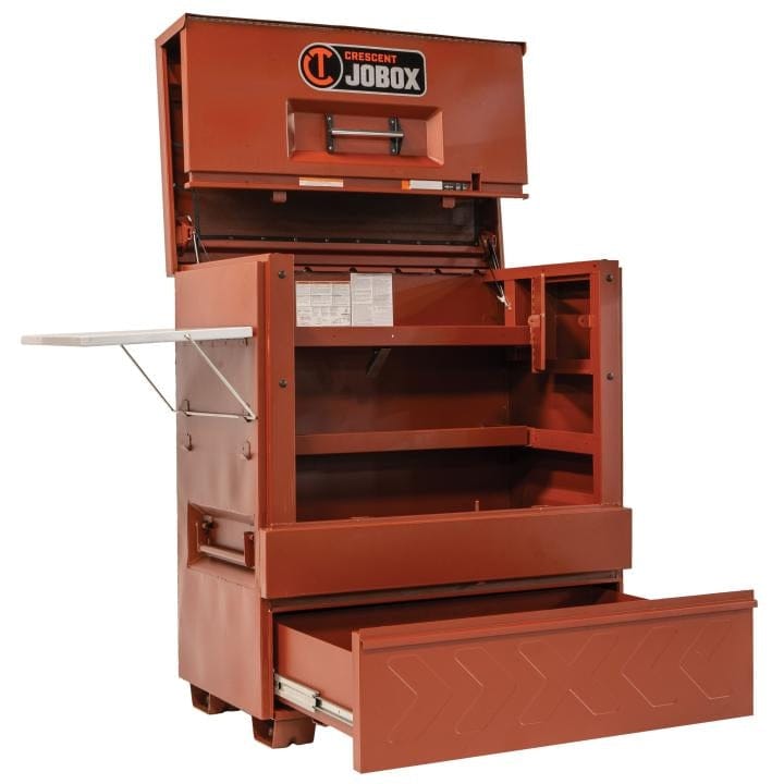 Crescent JOBOX 48-inch Site-Vault heavy-duty piano box jobsite storage cabinet, open and empty, showing interior shelves and an open drawer. A side shelf is extended.