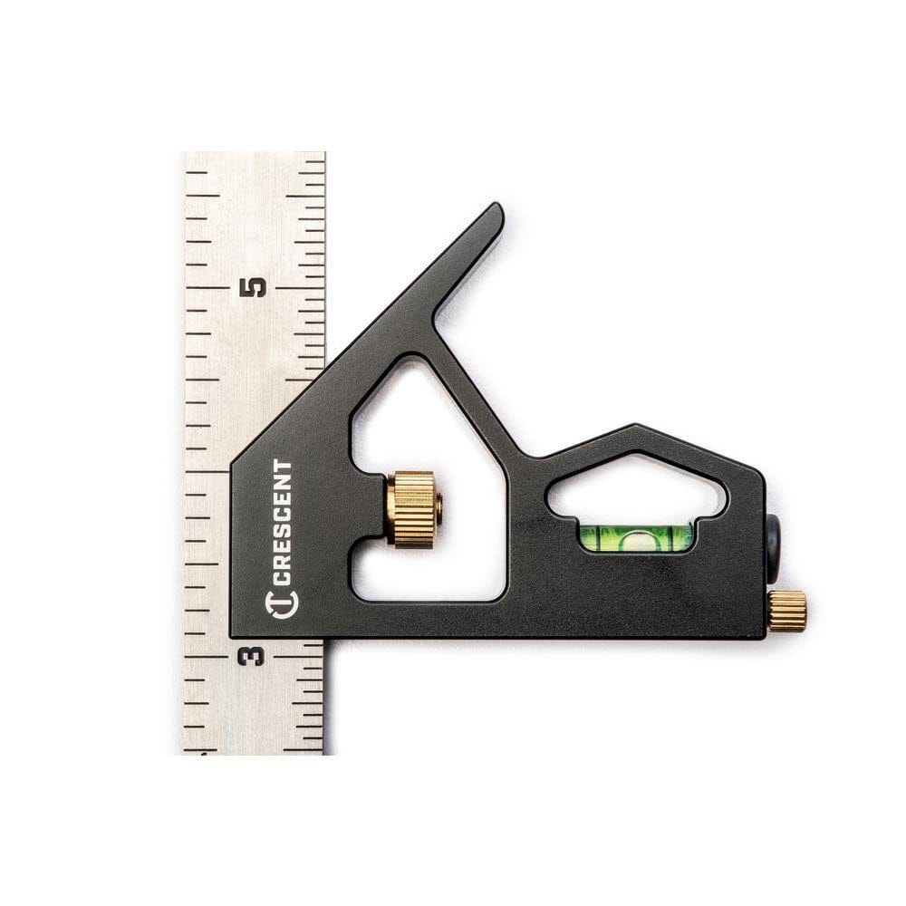Top-down view of the square positioned on the ruler, highlighting the 90-degree and 45-degree shoulders of the black head and the laser-etched measurements on the blade.