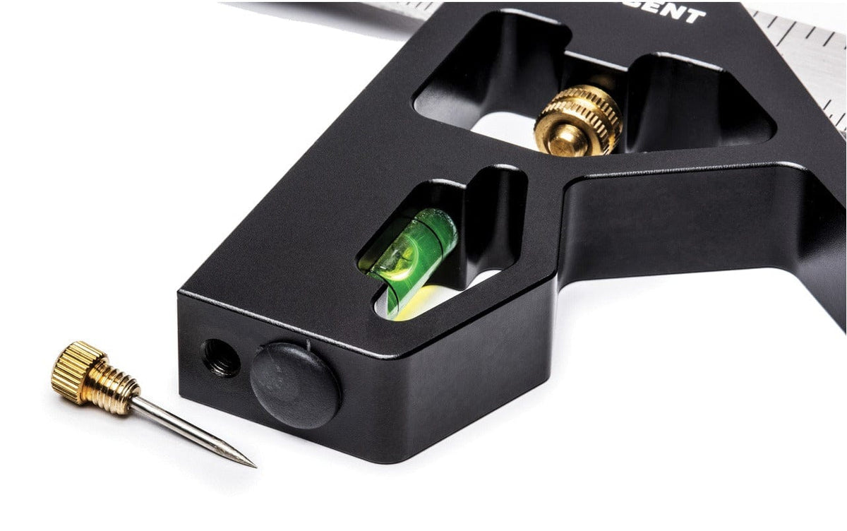 A close-up view of the Crescent L12CS combination square head showing the integrated spirit level and the removable brass scribe stored in the handle base.