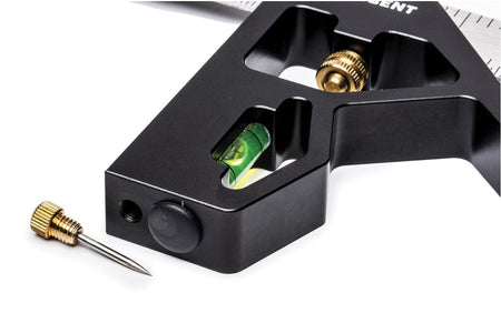 A close-up view of the Crescent L12CS combination square head showing the integrated spirit level and the removable brass scribe stored in the handle base.