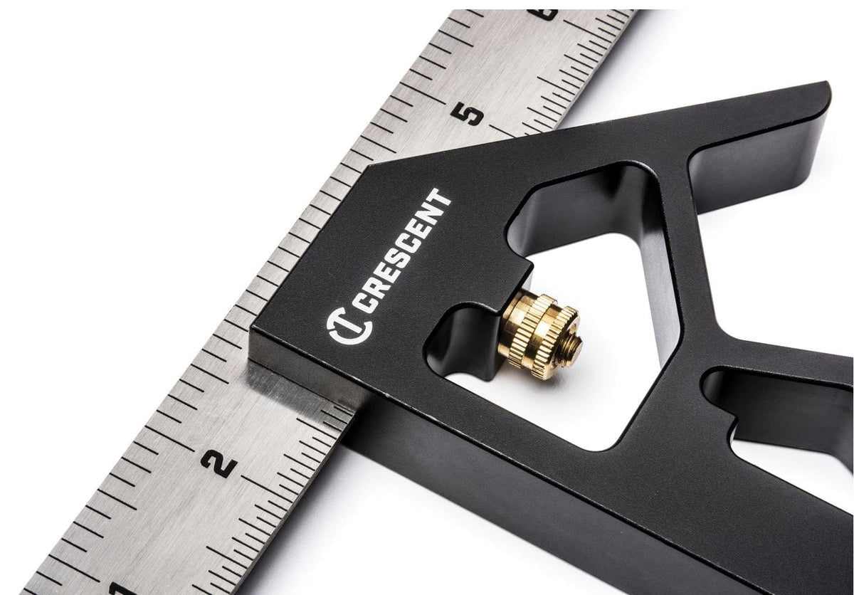 Detailed view of the knurled brass adjustment nut on the Crescent L12CS combination square used to securely lock the ruler into the aluminum head for precise measurements.