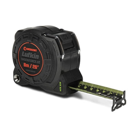 Angled product view of the Crescent Lufkin L1225ALCMEB-02 Shockforce Nite Eye G2 8m/26-foot tape measure with its high-contrast green-on-black blade extended, featuring a matte black impact-resistant case and a diamond-coated end hook.