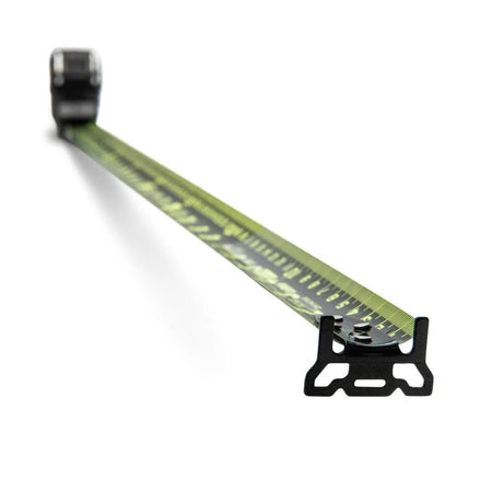 Perspective view from the end hook looking back along the extended Nite Eye blade, showcasing the high-legibility green markings on a matte black background designed for low-light jobsite conditions.