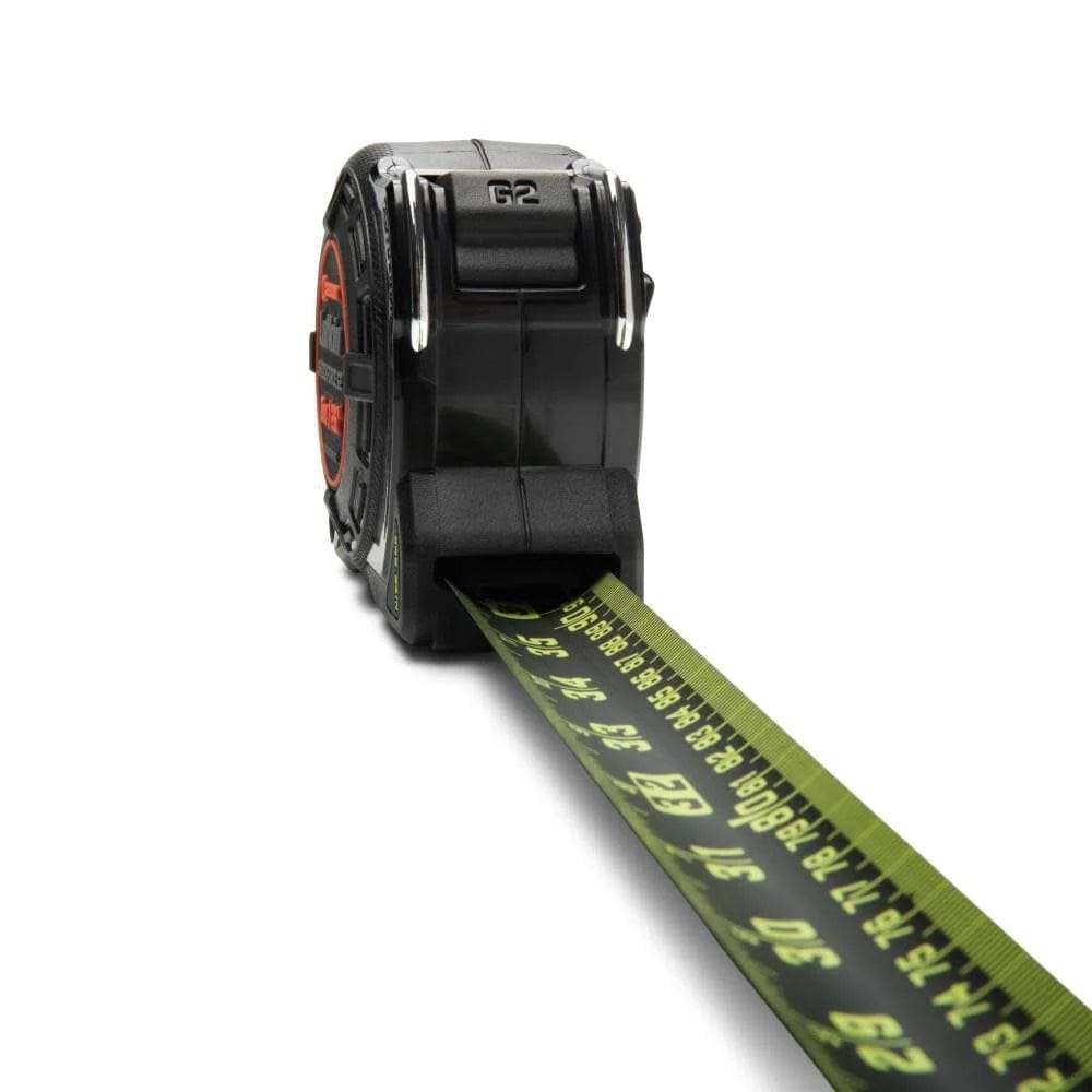 Close-up angled view of the Crescent Lufkin L1225ALCMEB-02 tape measure focusing on the auto-lock button and the extra-wide 1-1/4 inch blade with metric and imperial graduations.