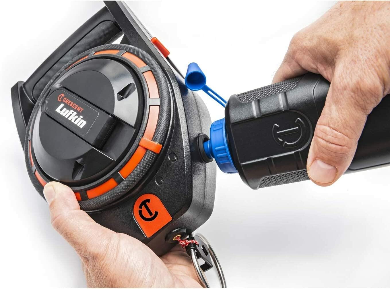 A person demonstrates refilling the Crescent Lufkin 150-foot chalk reel using the one-way valve on a Lufkin chalk bottle.