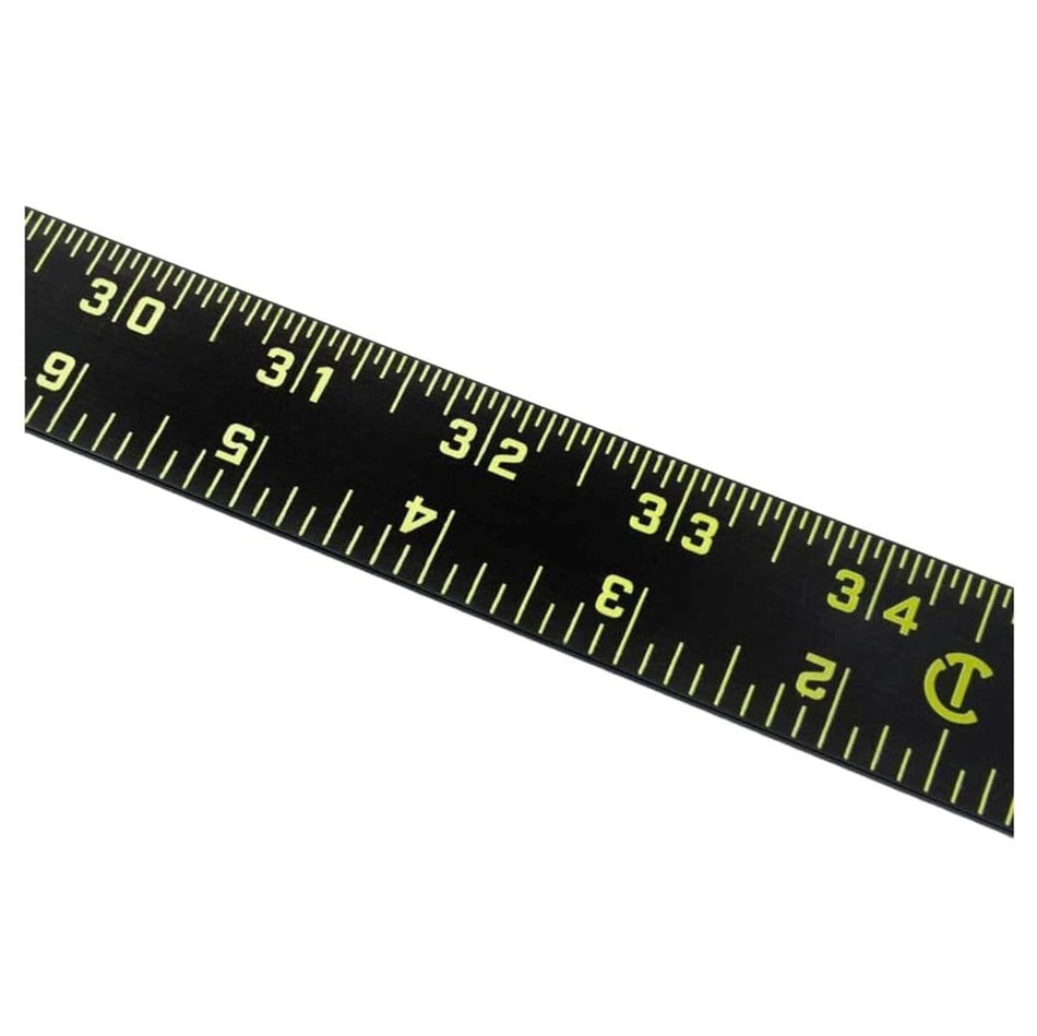 A close-up view of the Crescent Lufkin ALR48B Nite Eye aluminum rule highlighting the high-visibility neon green graduations and numbers against a high-contrast black finish for superior readability in various lighting conditions.