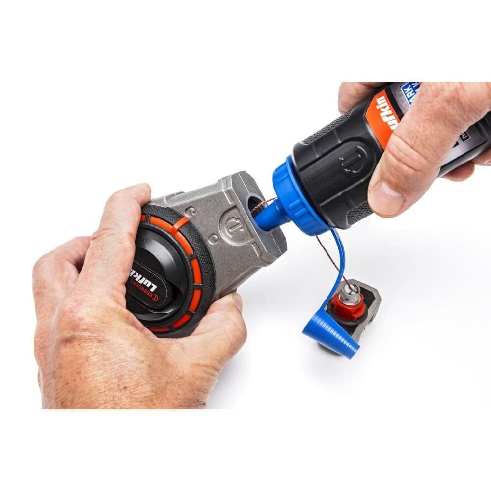 Detailed view of a user replenishing the Crescent Lufkin CLA100R aluminum reel through the side-mounted one-way refill port for faster job site preparation.