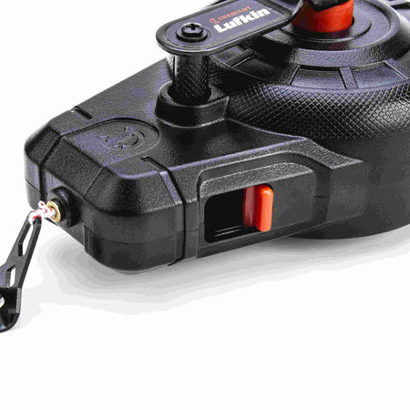 Detailed side view of the Crescent Lufkin professional chalk reel focusing on the high-visibility orange sliding fill door and the textured grip of the rewind assembly.