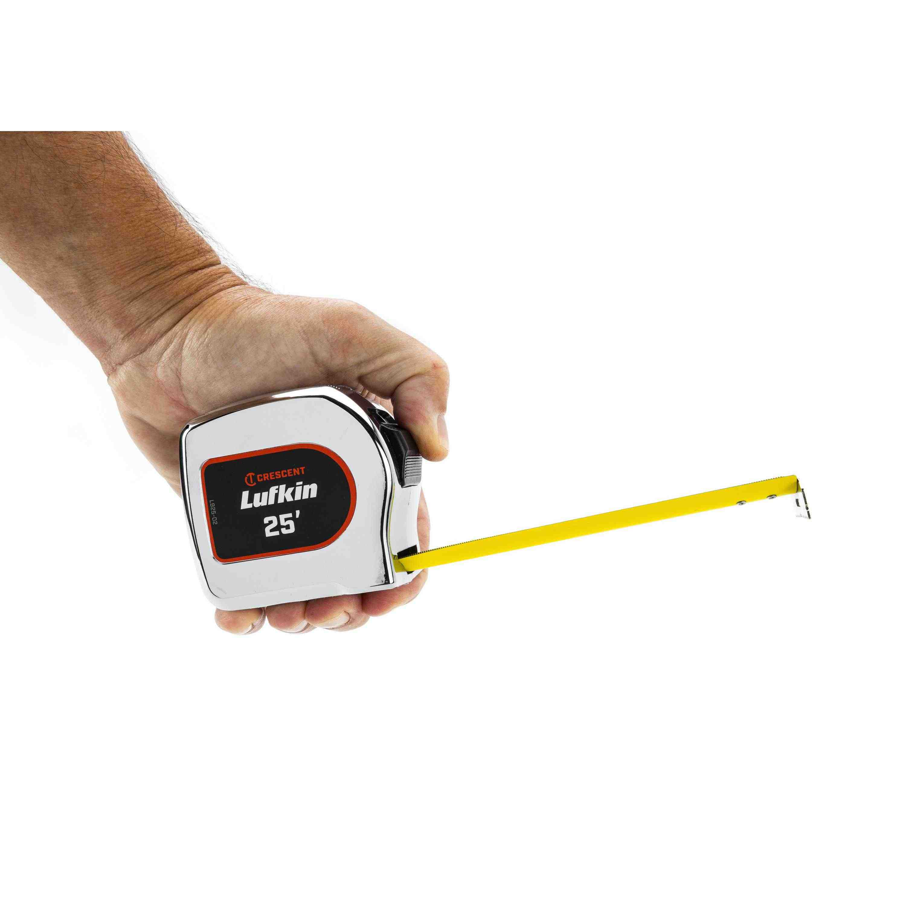 A user holding the Crescent Lufkin L925-02 tape measure in one hand with the matte nylon coated blade extended, illustrating the compact ergonomic design for site work.