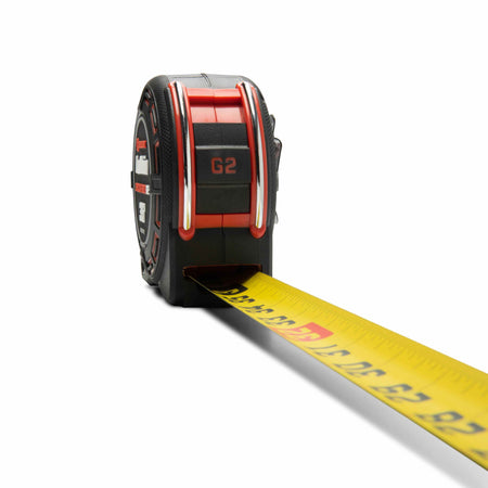 Perspective shot of the Crescent Shockforce G2 magnetic tape measure with the yellow blade extended, showcasing the high-contrast dual-sided measurement markings.