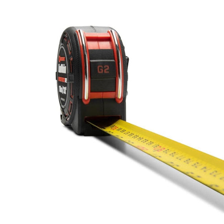 Close up of the 1-1/4 inch wide blade extending from the Crescent Lufkin Shockforce G2 tape measure showing the easy-to-read dual sided SAE metric scale.