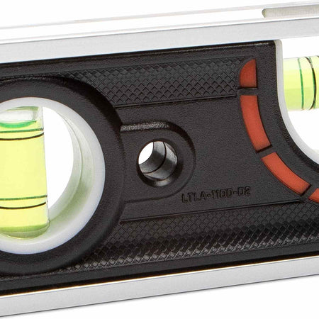 A detailed close-up of the center vial area on the Crescent Lufkin aluminum level showing the 1/4-inch pitch reference lines and the durable textured black grip surface surrounding the magnified vial.
