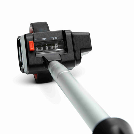 Top-down view of the Crescent Lufkin compact measuring wheel analog counter dial calibrated in feet and inches for accurate SAE distance calculations.