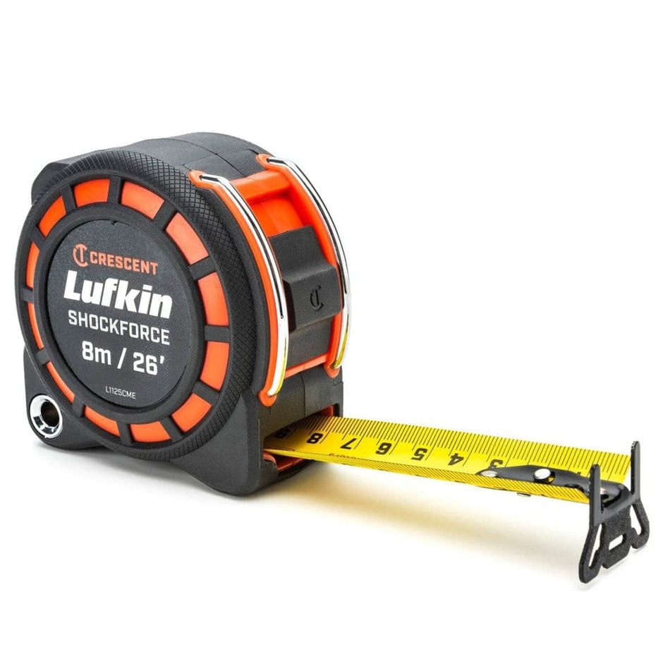 Perspective view of the Crescent Lufkin Shockforce G1 26-foot tape measure featuring a rugged black and orange impact-resistant case and a high-visibility yellow blade with a diamond-coated 360-degree end hook.